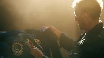 Former astronaut and ISS commander Michael Foale looks at his old NASA overall.