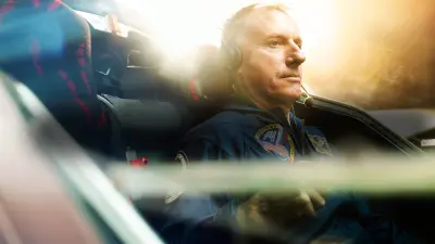 Former astronaut and ISS commander Michael Foale sits in the cockpit of a light aircraft.